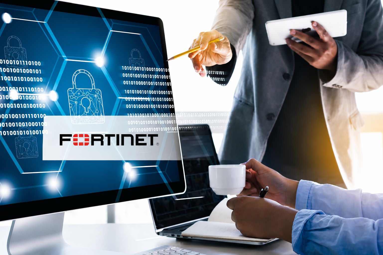 cybersecurity professionals facing a desktop monitor