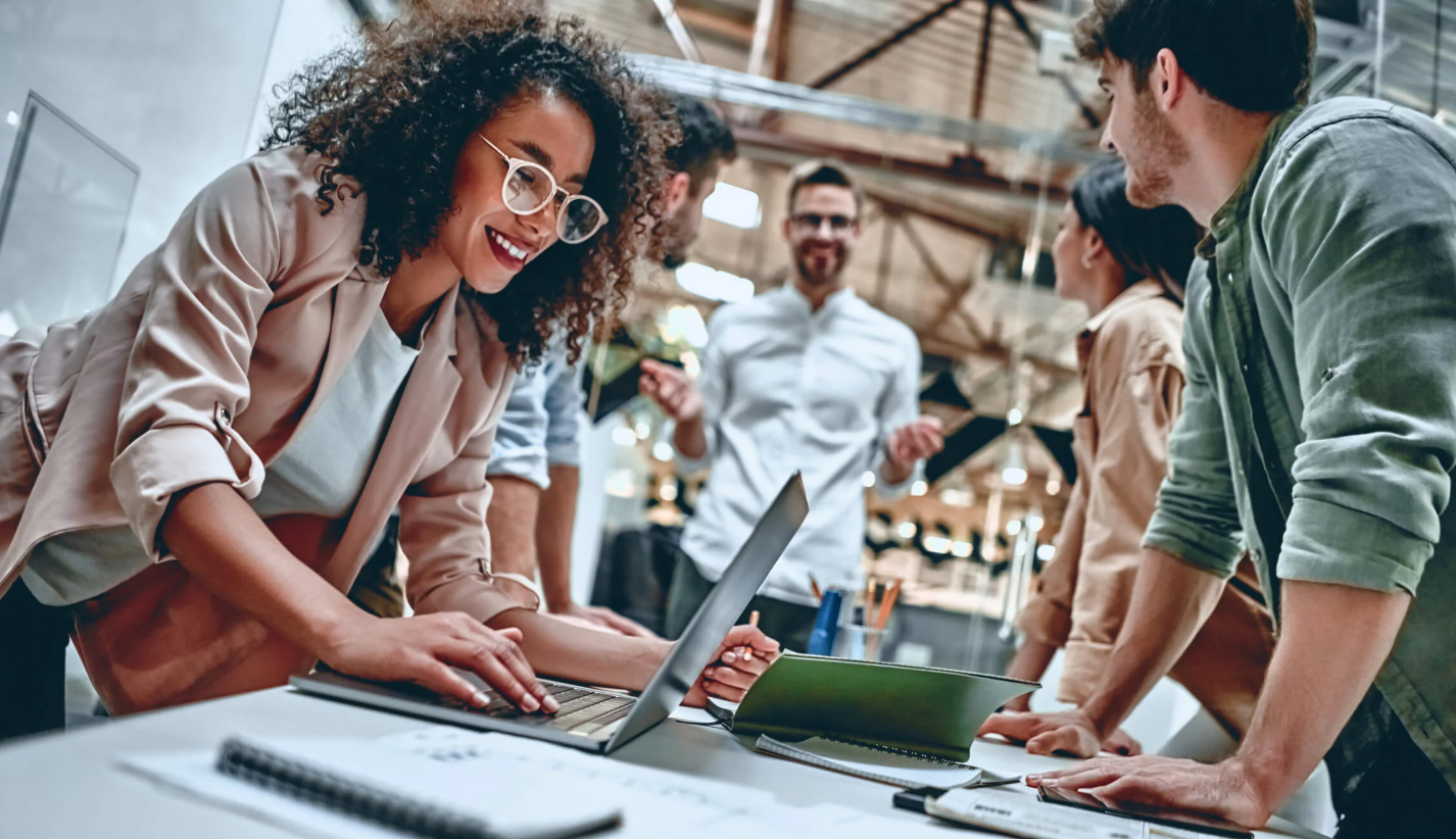 coworkers collaborating around a shared worktable