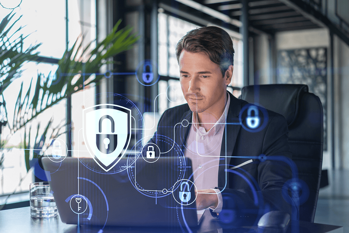 man at computer analyzing cybersecurity threats